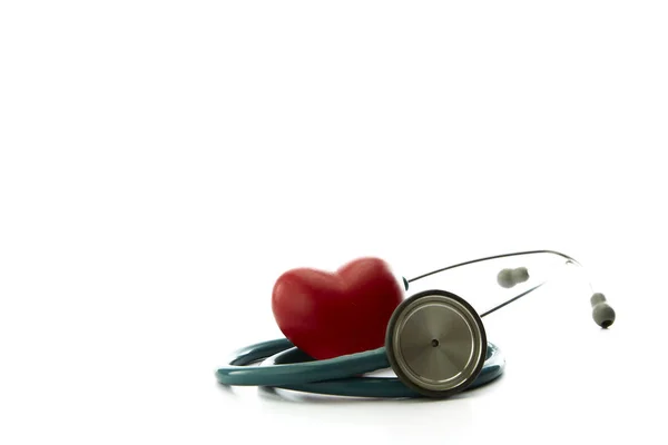 Red heart and a stethoscope on white — Stock Photo, Image