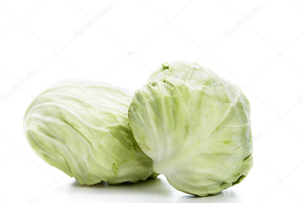 Fresh green cabbage on white background.