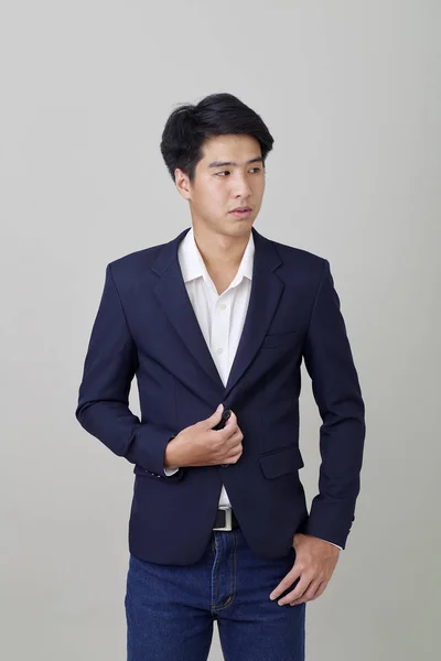 Portrait of fashionable asian entrepreneur on bright gray — Stok Foto