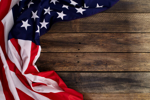 American flag on old brown wooden table