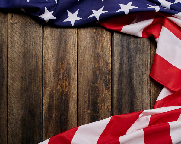 American flag on old brown wooden table