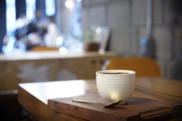 Hot coffee on wood table in cafe — 스톡 사진