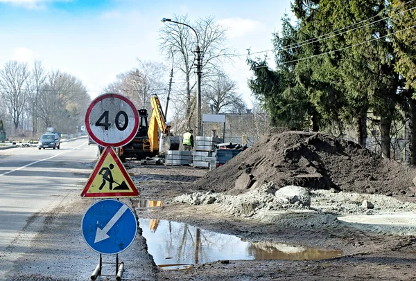 Road works. Traffic signs. Roadwork sign and keep left sign.