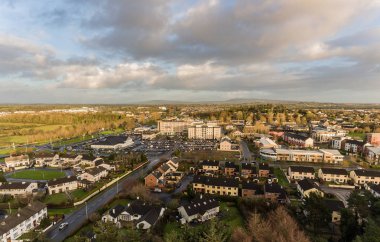 Shannon town center aerial skyline. Shannon town centre serves shannon shannon airport. key town in county clare ireland for tourist entering leaving ireland from shannon airport and industrial estate clipart