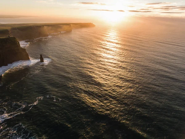 Aerial Ireland countryside tourist attraction in County Clare. The Cliffs of Moher sunset and castle Ireland. Epic Irish Landscape along the wild atlantic way. Beautiful scenic irish nature — Stock Photo, Image