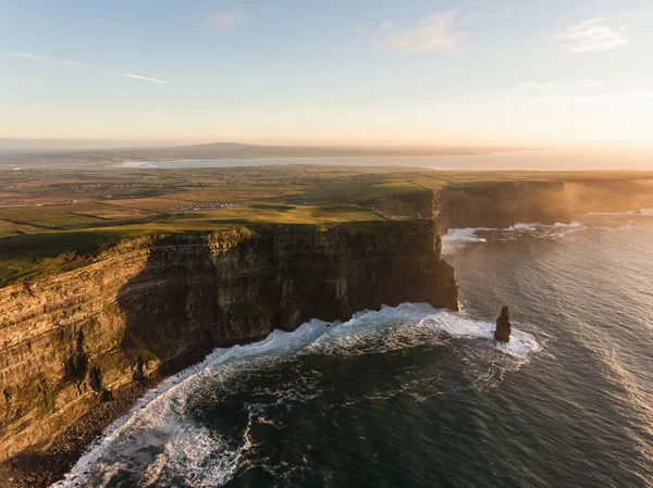 Aerial Ireland countryside tourist attraction in County Clare. The Cliffs of Moher sunset and castle Ireland. Epic Irish Landscape along the wild atlantic way. Beautiful scenic irish nature — Stock Photo, Image