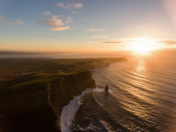 Aerial Ireland countryside tourist attraction in County Clare. The Cliffs of Moher sunset and castle Ireland. Epic Irish Landscape along the wild atlantic way. Beautiful scenic irish nature