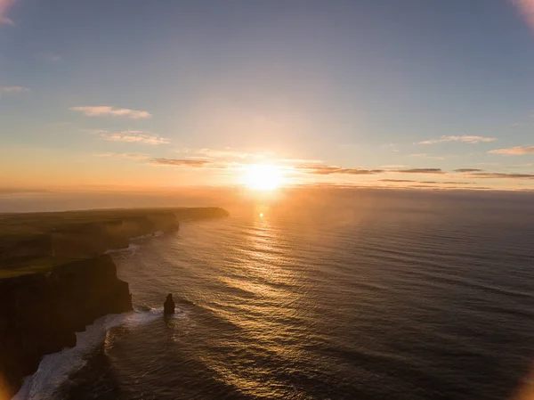 Aerial Ireland countryside tourist attraction in County Clare. The Cliffs of Moher sunset and castle Ireland. Epic Irish Landscape along the wild atlantic way. Beautiful scenic irish nature