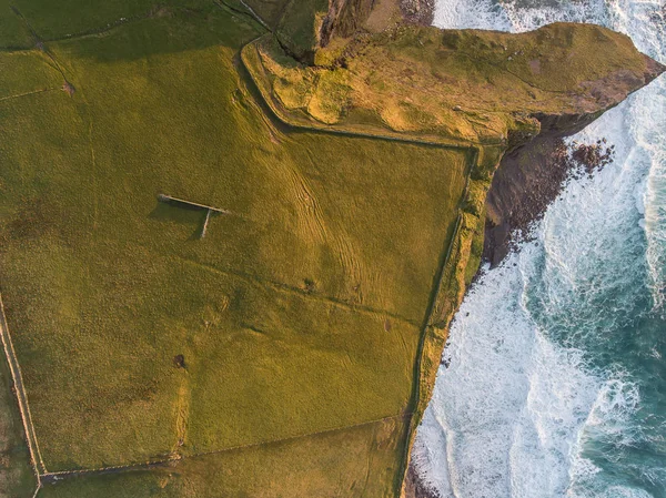 Aerial Ireland countryside tourist attraction in County Clare. The Cliffs of Moher sunset and castle Ireland. Epic Irish Landscape along the wild atlantic way. Beautiful scenic irish nature