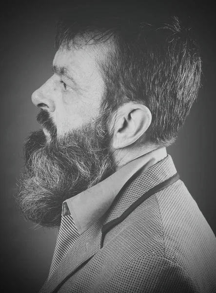 Studio portrait of fully bearded man in black and white.  Closeup face with facial expression. — Stock Photo, Image