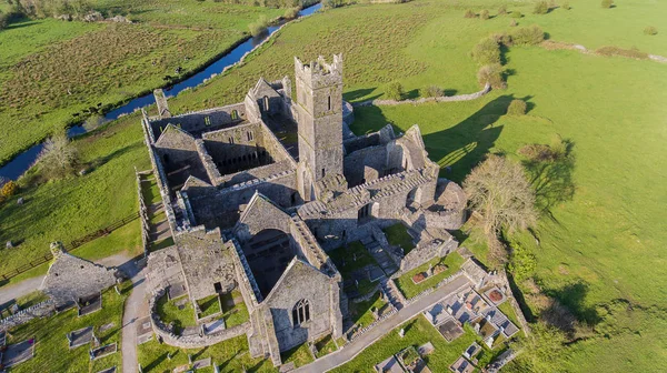 Aerial view of an Irish public free tourist landmark, Quin Abbey, County clare, Ireland. Aerial landscape view of this beautiful ancient celtic historical architecture in county clare ireland.