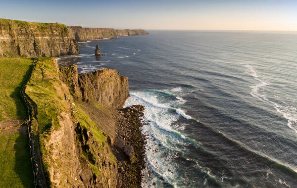 Aerial birds eye view from the world famous cliffs of moher in county clare ireland. beautiful irish scenic landscape nature in the rural countryside of ireland along the wild atlantic way.