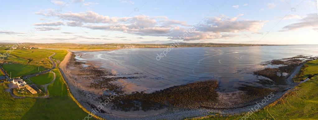 Aerial Birds Eye View Of A Beautiful Irish Sunset Countryside Landscape In County Clare Ireland. Lahinch Beach in the distance along the wild atlantic way.