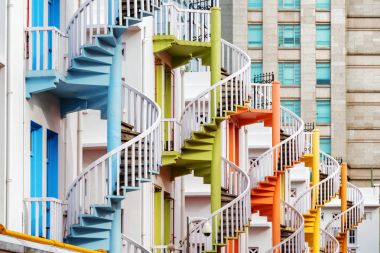Colorful exterior spiral staircases, Singapore clipart