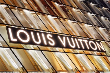 Glowing logo of Louis Vuitton store by Marina Bay, Singapore clipart