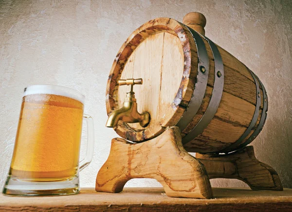 Bottom view of wooden beer keg and mug of beer Stock Image