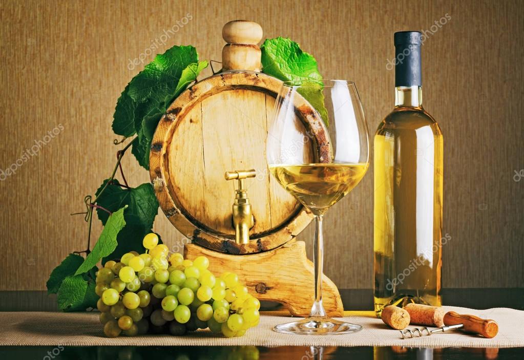 Italian wine with twig on bottle Wooden wine barrel with grape twig