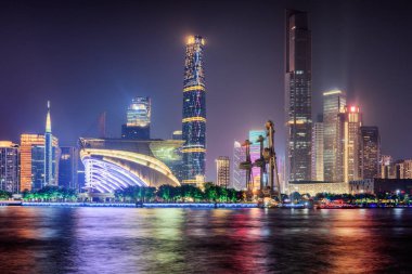Night view of skyscrapers and the Pearl River. Guangzhou skyline clipart