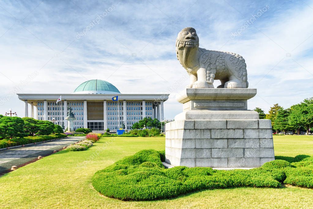 Korean lion dog statue and the National Assembly building, Seoul