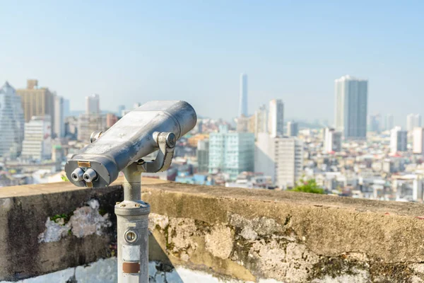 Shabby tower viewer at observation deck in Macau