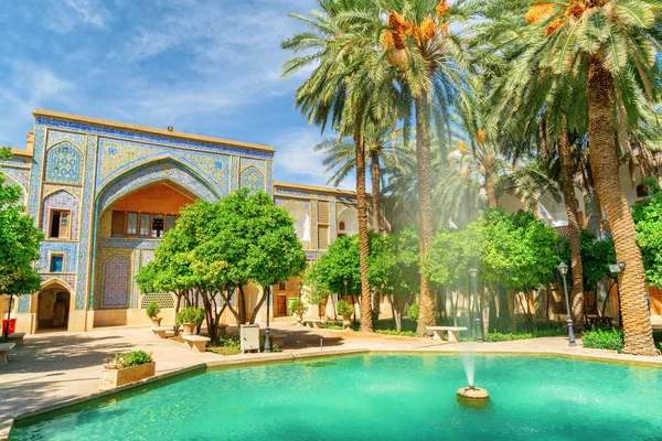 Gorgeous fountain in the middle of traditional Persian courtyard