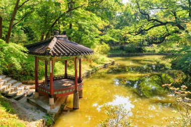 Seoul, South Korea - October 13, 2017: Awesome view of colorful pavilion in Huwon Secret Garden of Changdeokgung Palace. Traditional Korean architecture. The garden is a popular tourist attraction.