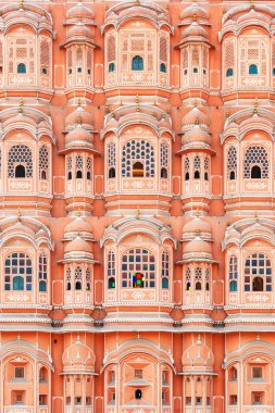 Jaipur, India - 11 November, 2018: Gorgeous windows of the Hawa Mahal (Palace of Winds) at the Old Pink City. Jaipur is a popular tourist destination of South Asia. clipart