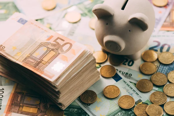 Piggy moneybox with euro cash — Stock Photo, Image