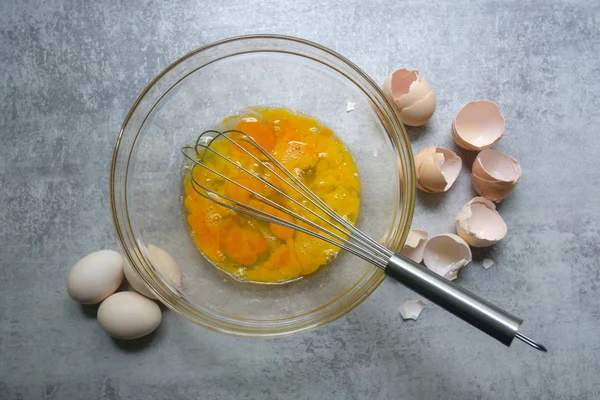 Raw eggs in glass bowl — Stock Photo, Image