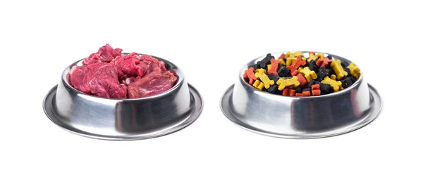 Different dogs food in metal plates isolated — Stock Photo, Image