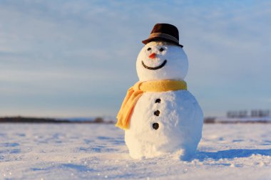 Funny snowman in black hat clipart