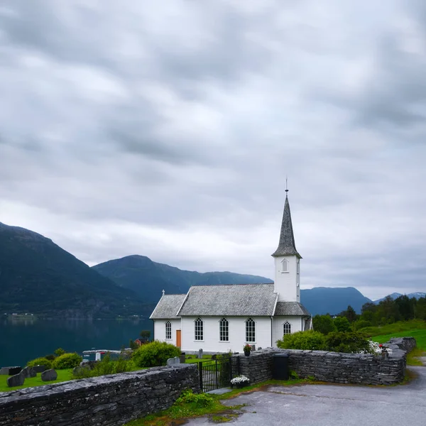 Typical christianity church with cemetery of Nes village — Stock Photo, Image