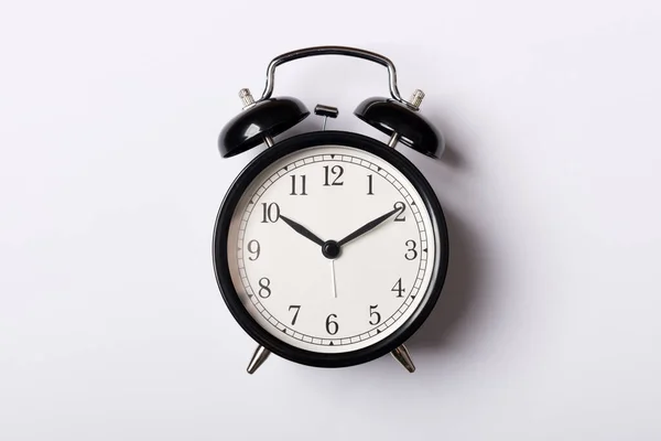 Black vintage alarm clock on white background — Stock Photo, Image