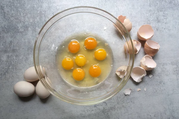 Raw eggs in glass bowl — Stock Photo, Image