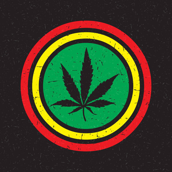 Cannabis leaf on grunge rastafarian background circle. 