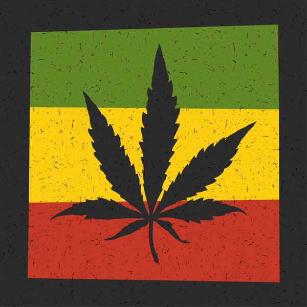 Cannabis leaf on grunge rastafarian flag. 