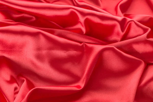 Abstrato vermelho tecido de cetim fundo — Fotografia de Stock