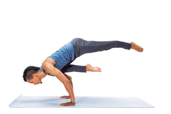 Young man doing yoga exercise — Stock Photo, Image