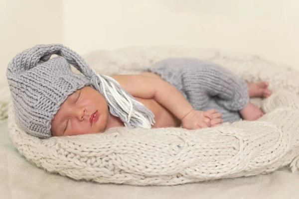 Sleeping newborn baby in a wrap — Stock Photo, Image