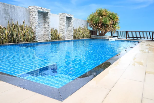 Corner border path of pool on deck public building. Stock Picture