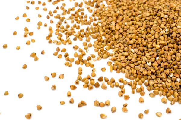 Buckwheat sprinkled on a white — Stock Photo, Image