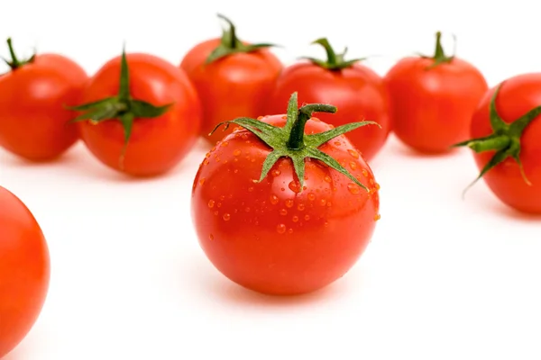 Maturi pomodori rossi su un bianco — Foto Stock