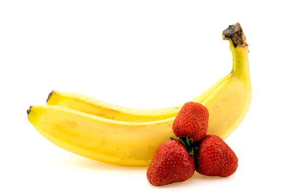 Bananas and strawberries on white — Stock Photo, Image