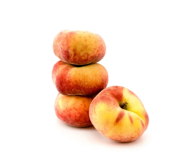 Flat peaches on a white — Stock Photo, Image