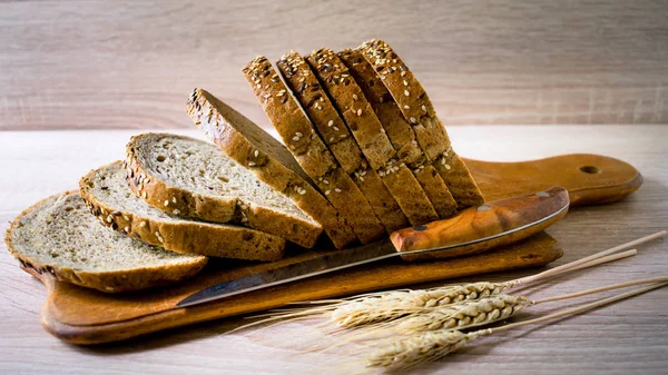 Sliced grain bread on a wooden Board