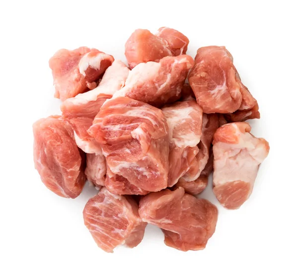 Pile of raw meat on a white background. The view of the top. — Stock Photo, Image