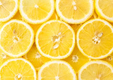 Abstract background of lemon slices top view.