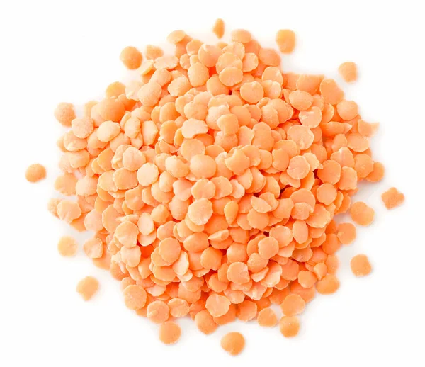 Pile of red lentils on a white background. The view from top. — ストック写真