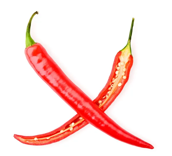 Red pepper and half lie crosswise on a white. The view from the top. — Stockfoto