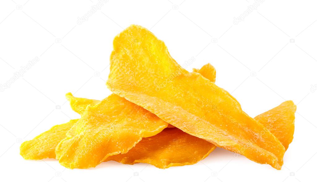 A pile of dried mango slices close-up on a white background. Isolated